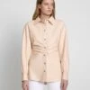 7 For All Mankind Faux Leather Cinched Waist Button Up Shirt In Nude -Mod Cloth Store 1261888a53e1ee12ba2fb83f6ae9952b